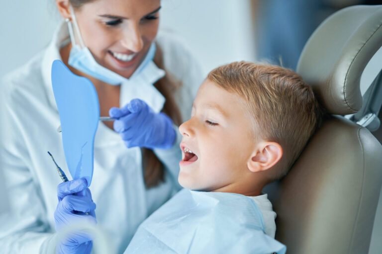Little Boy And Female Dentist In The Dentists Office kids dentist heathmont - Heathmont Dental clinic